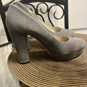 Michael Kors suede grey platform heels with silver chain on the heel.